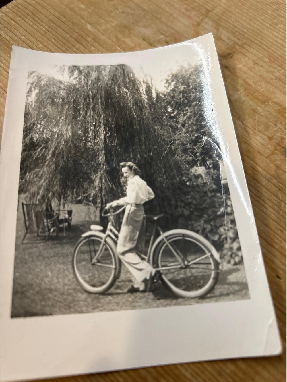 Vintage photo of a woman on a bicycle